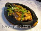 Hot appetizers : Pork (served in a frying pan)